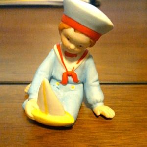 Holly Hobbie "boy with boat" approx 2 inches high